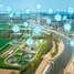 A water treatment plant, a river and a city from above with icons representing digitalization